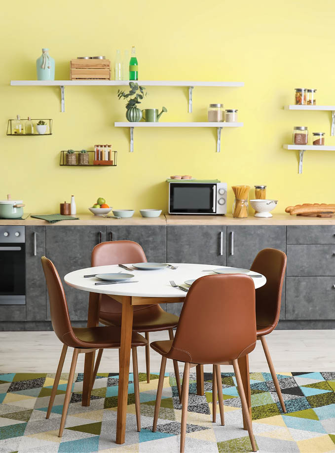 Dining table and chairs in interior of modern kitchen