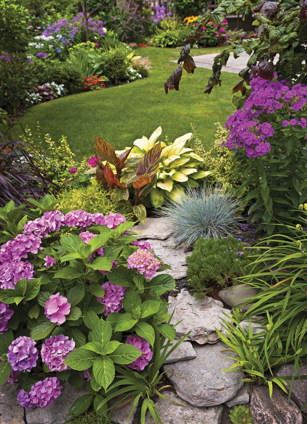 Lush landscaped garden with flowerbed and colorful plants