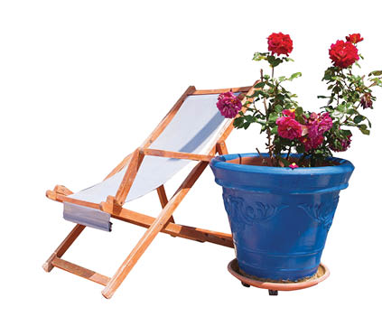 Veranda with pergola and sun beds, surrounded by flowers 