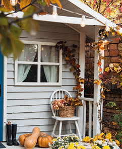 Autumn country house, decorated with pumpkins and apples . American style country yard, nobody
