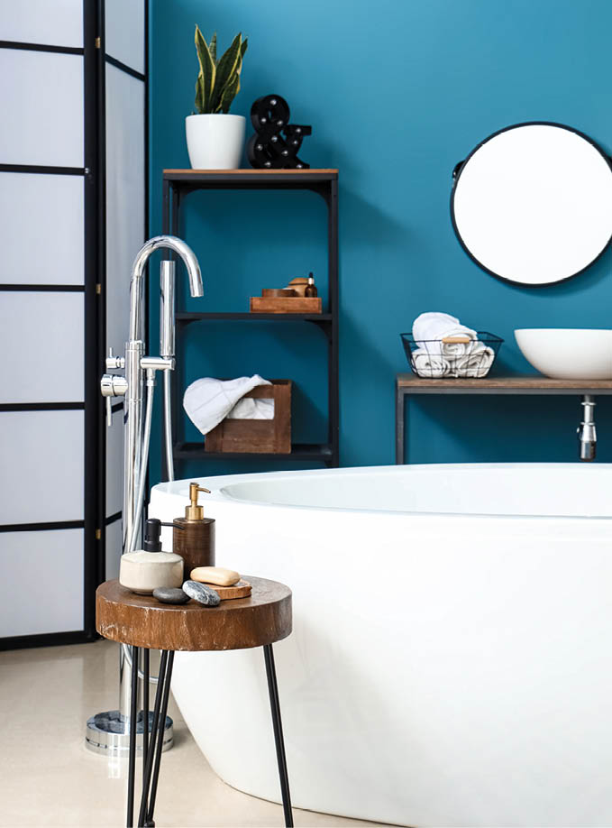 Interior of bathroom with sink, bathtub and shelving unit