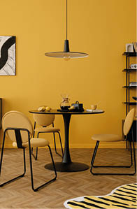 Creative composition of dinning room interior with mock up poster frame, round table, stylish chair, yellow wall, black rack, lemon, patterned carpet and personal accessories. Home decor. Template.