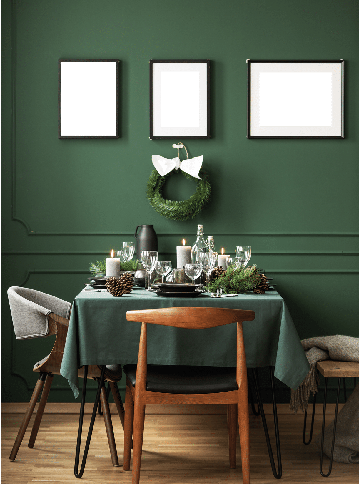 Bottle green dining room with table set for Christmas dinner