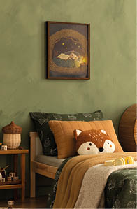 A charming and cozy children's bedroom featuring forest-themed decor, including an animal pillow and wall art, promoting a calm and inviting mood. Ideal for home decor, lifestyle, and stock media