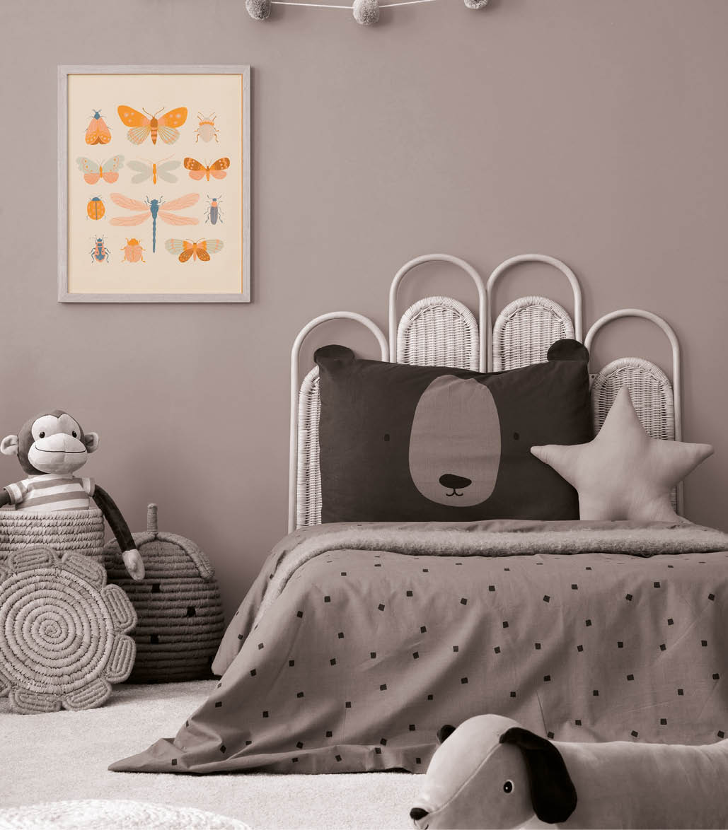 Warm child room interior with mock up poster frame, braided basket, guitar, braided bed, plush lama, monkey, brown bedding, colorful garland and personal accessories. Home decor. Template.