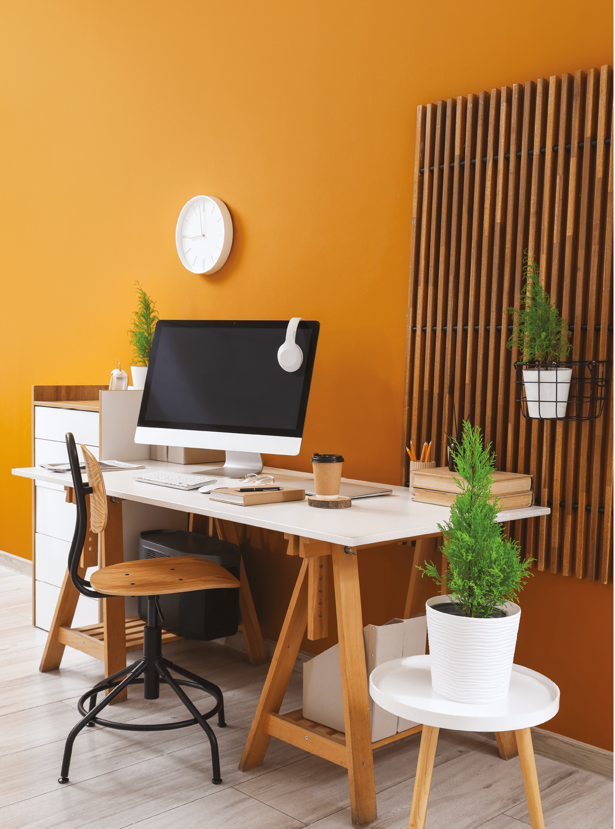 Interior of stylish office with workplace and cypress trees