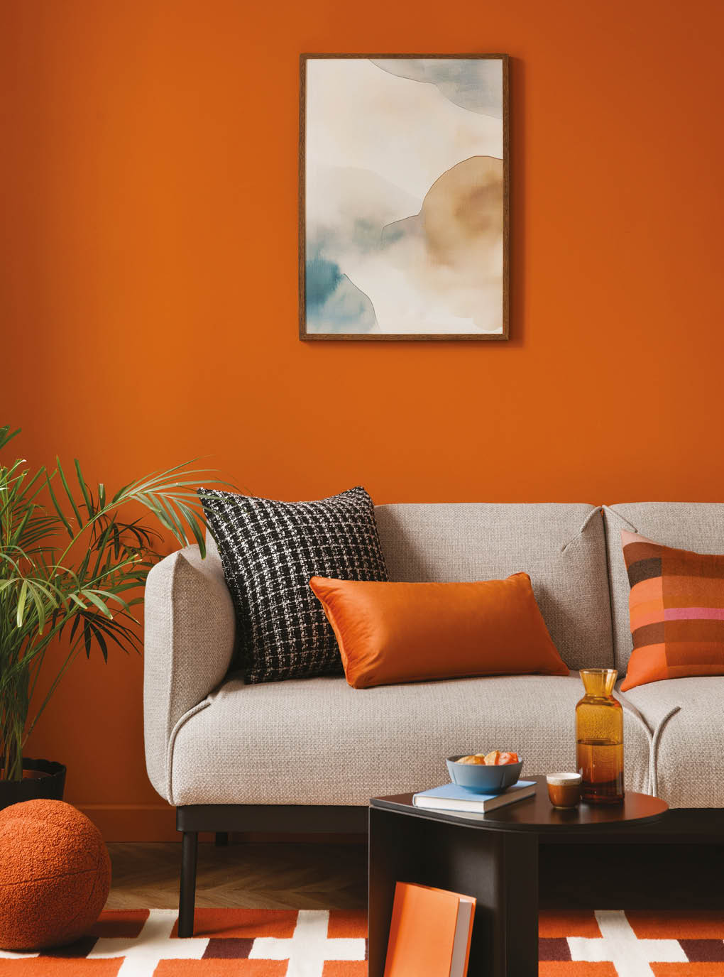 Modern retro style of living room interior with grey sofa and design decorations. Mock up poster on the wall.